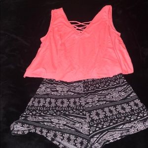 Coral/peach and black and white patterned romper